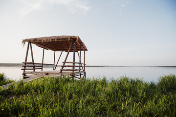 beautiful wooden gazebo by the lake