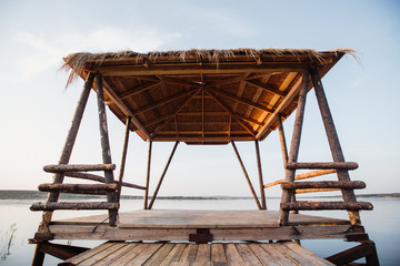 beautiful wooden gazebo by the lake