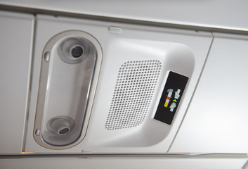 No smoking sign and seat belt sign on the airplane