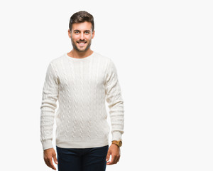 Fototapeta premium Young handsome man wearing winter sweater over isolated background with a happy and cool smile on face. Lucky person.