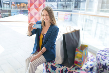  lifestyle concept. woman on shopping with credit card and phone.