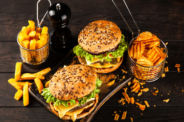 Delicious grilled burgers © George Dolgikh