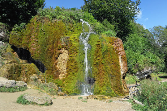Travertine waterfall Dreinmuehlen (engl. three mills) at Nohn in  Vulkan Eifel region (Germany)