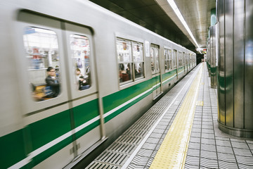 view of moving train in the station of osaka