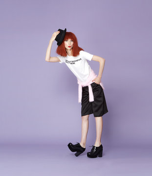 Red haired model posing in vintage dress