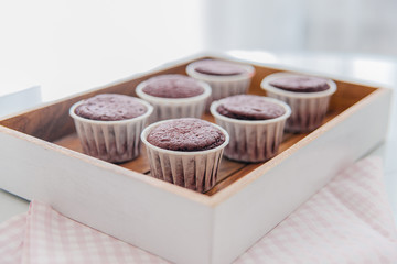 a concept of baking sweet cupcakes and muffins at home