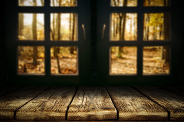 desk of free space and autumn window background 