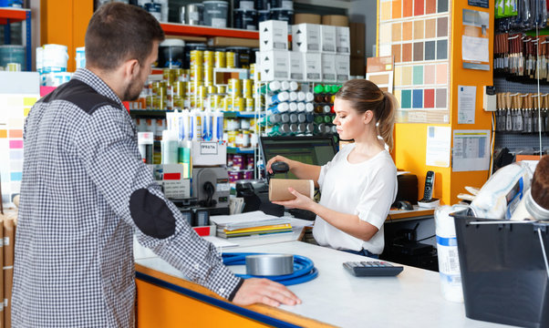 Man with purchases in household store