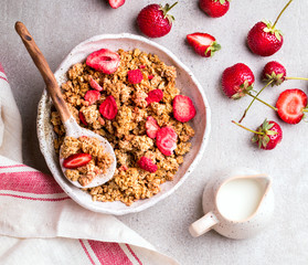 Granola Cereal bar with Strawberries on the Gray Background. Muesli Breakfast. Healthy Food sweet dessert snack. Diet Nutrition Concept. Top View. Vegetarian food.Flat Lay.Copy space for Text.