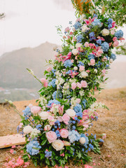 Arch with beautiful flowers. Wedding decor for ceremony.