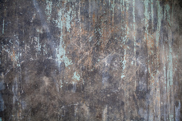 Stylish, grunge and rustic old wall with faded, vintage and textured paint. Dark tone color. Suitable for background, abstract, pattern and copy space.