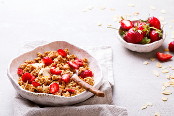 Granola Cereal bar with Strawberries on the Gray Background. Muesli Breakfast. Healthy Food sweet dessert snack. Diet Nutrition Concept. Top View. Vegetarian food.Flat Lay.Copy space for Text.