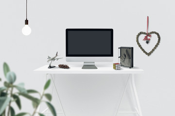 white table on white background with monitor