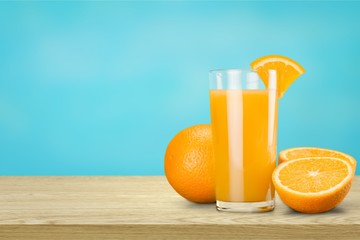 Orange juice and slices of orange on background