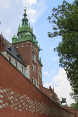 Fototapeta na wymiar view of historical tower of Sigismund (Wieza Zygmuntowska) with monument of Tadeusz Kosciuszko on Wawel hill in Krakow, Poland.