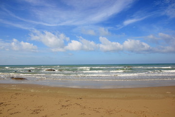 Fototapeta na wymiar Beach and blue sky, Sea and tinny clouds.For background.