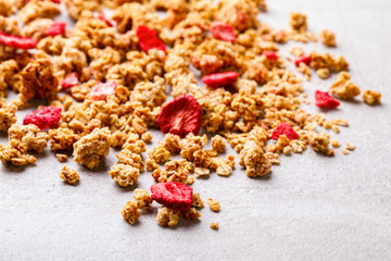 Granola Cereal bar with Strawberries on the Gray Background. Muesli with  fruit and berries Useful Breakfast. Healthy Food sweet dessert snack. Diet Nutrition Concept.  Vegetarian food.