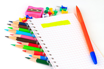 office supplies: notepad, pencils, and writing materials