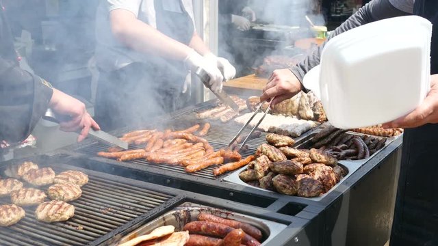 Grilled pork and chicken meat, lamb roasted on a spit - street food festival