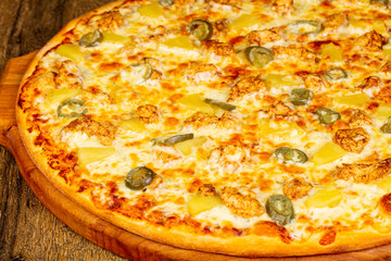 Pizza with pineapple and chicken