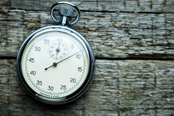 Vintage soviet stopwatch on the wooden boards