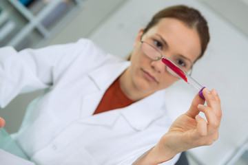 inspecting the blood sample