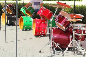 Row of colorful drums outside in the park 