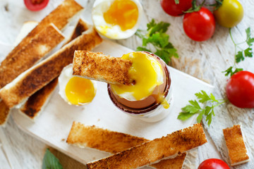 Fototapeta na wymiar Soft-boiled egg with toasts