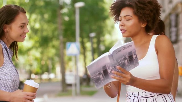 tourism and travel concept - tourists with city guide asking local woman for help