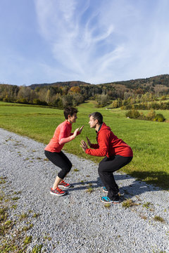 A couple is set ready for outdoor exercises on a sunny autumn day in the countryside of Bavarian National Forest Park