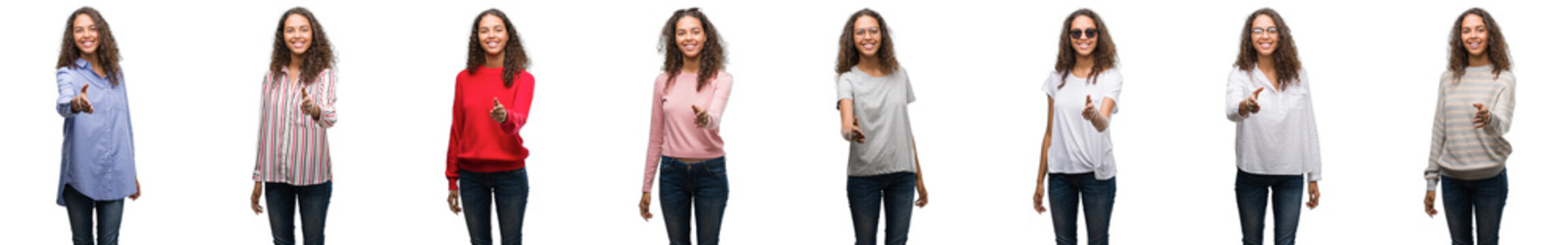 Composition of young brazilian woman isolated over white background smiling friendly offering handshake as greeting and welcoming. Successful business.
