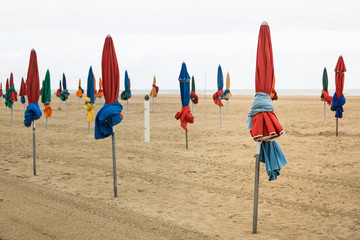 Closed Colorful Beach Umbrellas on an Overcast Day in Deauville, France