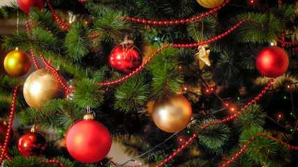 Closeup photo of Christmas tree with red and golden balls