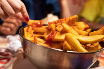 bowl of chips with ketchup