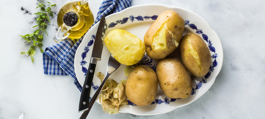 banner of cleaning boiled potatoes. home kitchen. healthy ingredients