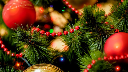 Closeup image of Christmas tree branches adorned for winter holidays