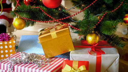 Big stack of presents and gift boxes under Christmas tree