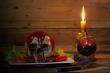 Food for Halloween night with candle light on old wooden table