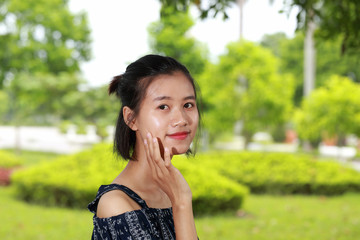Fototapeta premium the face of young woman in bright background