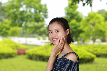 Fototapeta premium the face of young woman in bright background