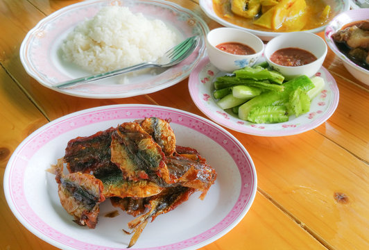 Fried fish with fresh vegetable and nam prik kapi spicy shrimp paste dip and rice, Thai food