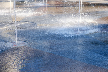 Water in park fountain. Hot summer. Happy holiday.