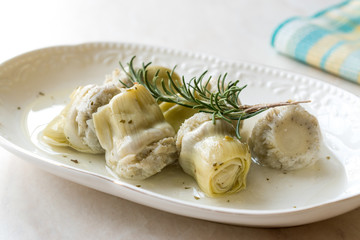 Pickled Artichoke Hearts with Rosemary Marinated in Plate.