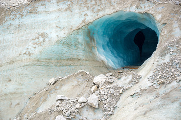 Entrance of an ice cave in the glacier Mer de Glace, in Chamonix Mont Blanc Massif, The Alps, France