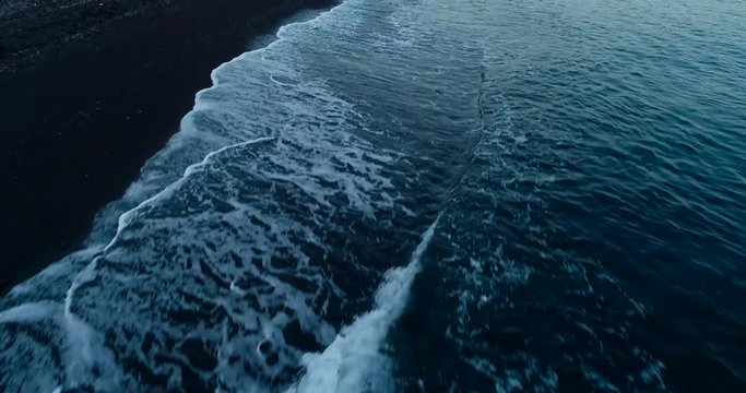 Aerial sunrise view of the beach Amed and volcano Agung, Bali. 4K