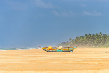 Fototapeta premium Fishing boat on tropical beach in Sri Lanka
