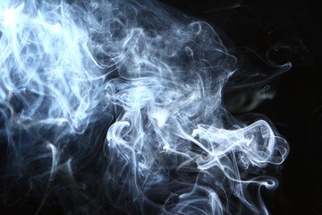 lovely flowing glowing bright smoke on heavy black background.