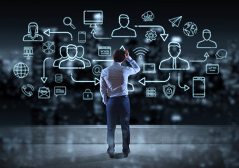 Businessman watching thin line social network icons interface