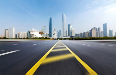 Obraz premium Empty road floor surface with modern city landmark buildings of guangzhou bund Skyline