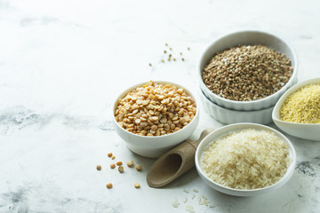 Assorted grains in the white bowls
